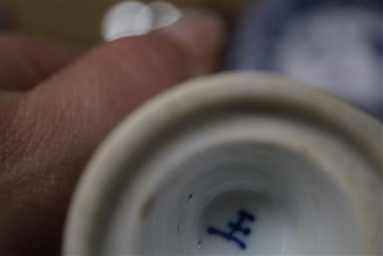 A Chinese blue and white tea bowl and saucer and two jars, Kangxi, some damage, largest diameter 11cm